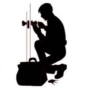 Locksmith working on a door lock